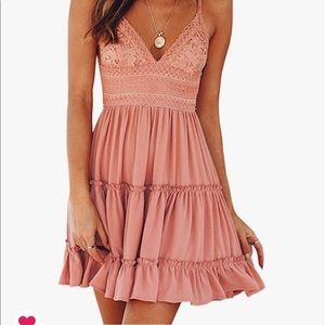 Spaghetti strap vneck open back dress with bow tie detail in back.